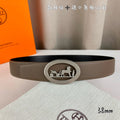 Hermes leather belt with taupe strap and silver oval horse-logo buckle