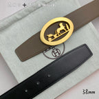 Hermes leather belt with taupe strap and gold oval buckle, black strap beneath