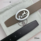 Hermes leather belt with taupe strap and silver oval buckle, black strap beneath