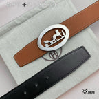 Hermes belt set: tan leather belt with silver oval buckle and black leather belt.