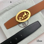 Hermes belt set: tan leather belt with gold oval buckle and black leather belt.