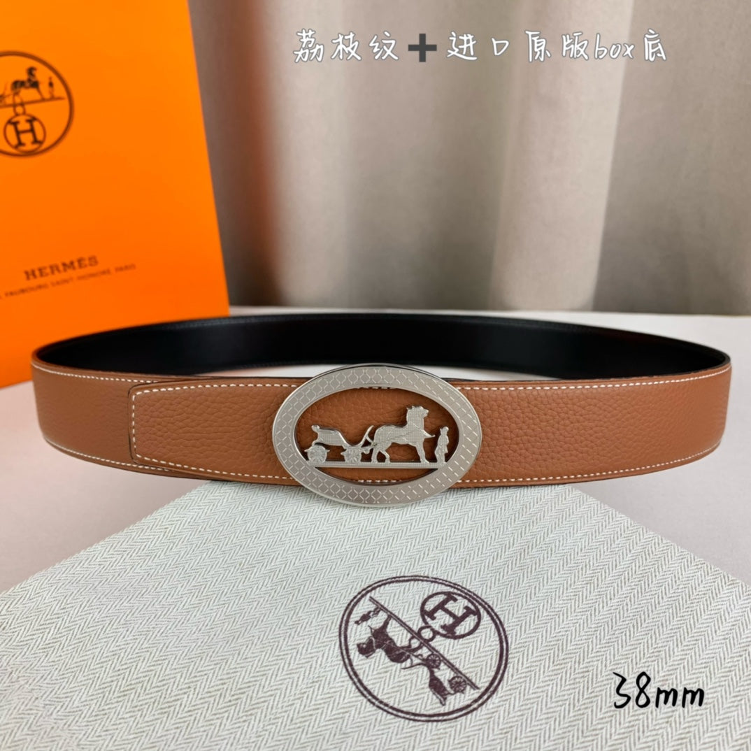 Hermes belt in tan leather with silver-tone oval buckle and horse rider motif.