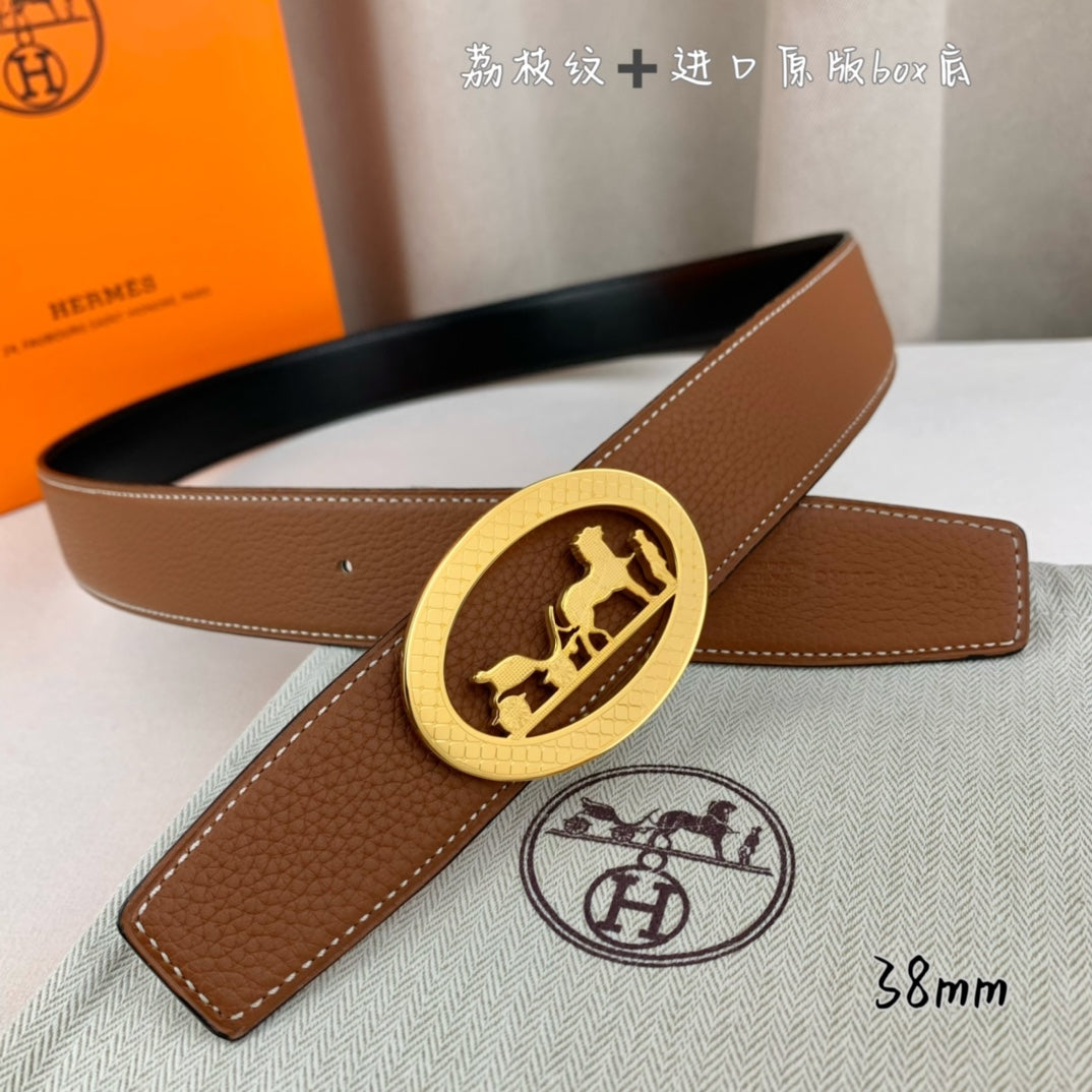Hermes belt in tan leather with gold-tone oval buckle and long strap end.