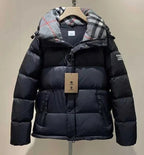 Burberry puffer jacket with plaid-lined hood, front zipper and snap buttons, dark outer