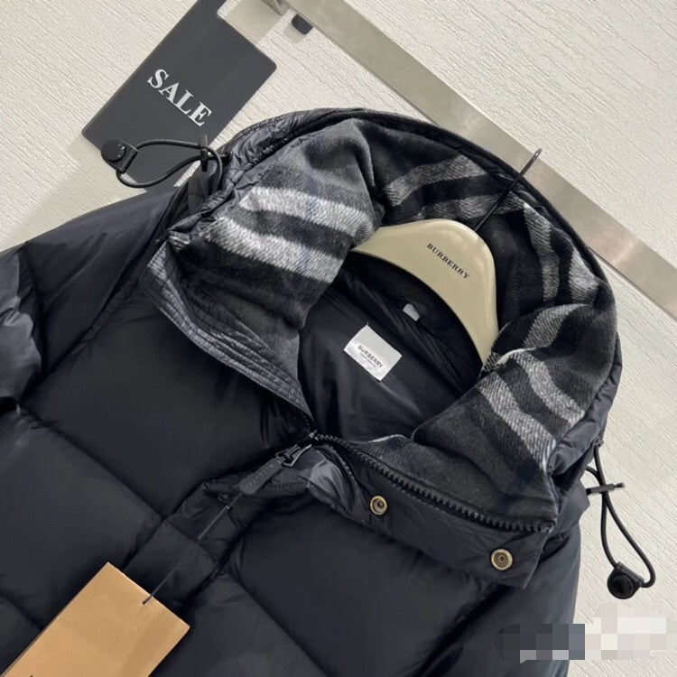 Burberry puffer jacket hood close-up with plaid lining and black interior, drawcord detail