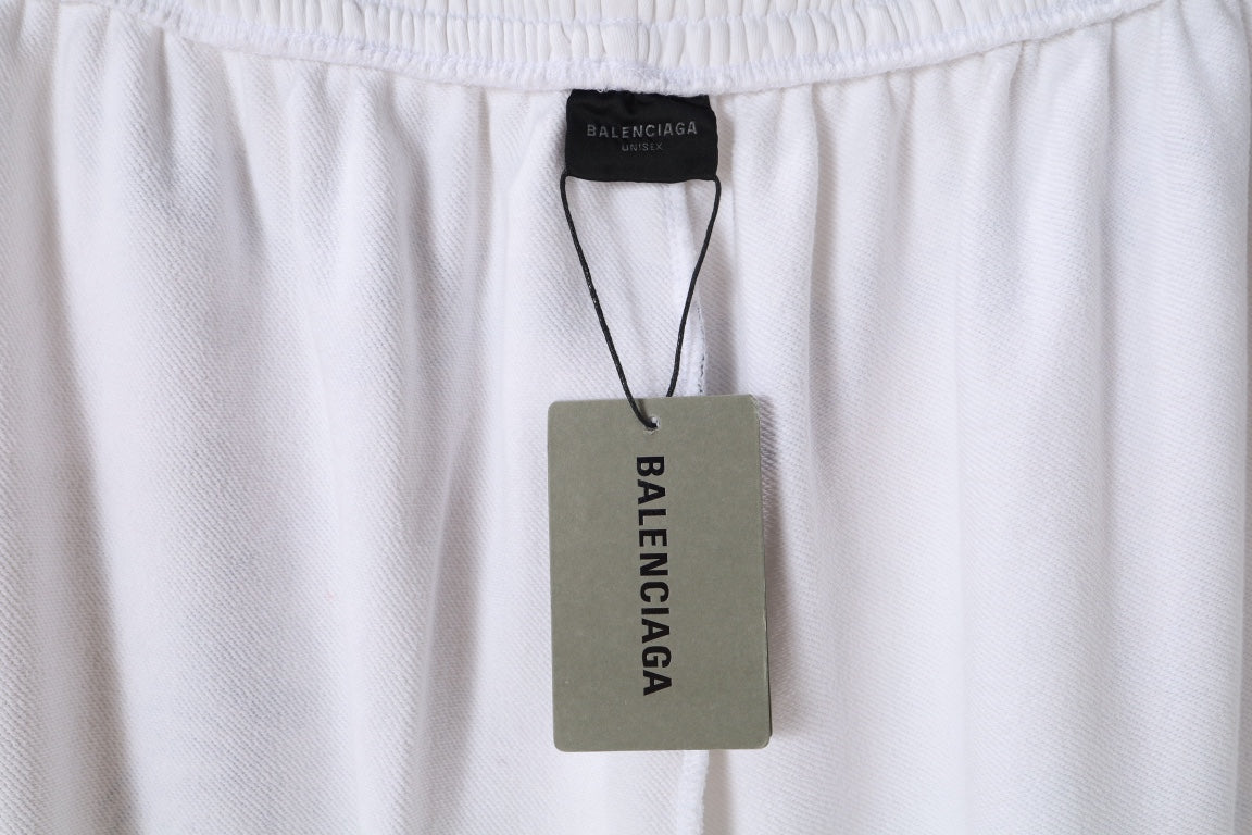 White pants with elastic waistband and Balenciaga label