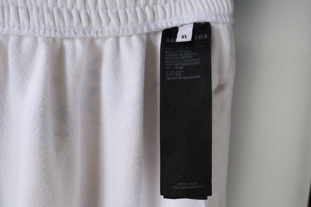 White pants with size tag label inside waistband