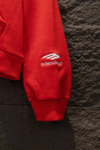 Red hoodie sleeve cuff with small logo on side
