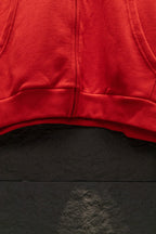 Red zip hoodie hem with center seam and zipper opening