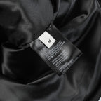 Black fabric interior with size label and printed fabric composition information