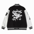 Black and white varsity jacket back with embroidered graphic and striped ribbed hem