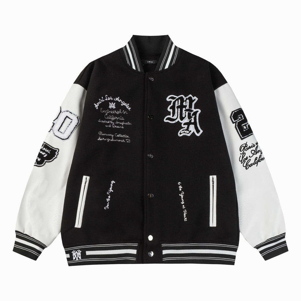 Black and white varsity jacket with snap buttons, ribbed collar, and striped cuffs