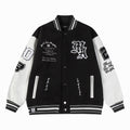 Black and white varsity jacket with snap buttons, ribbed collar, and striped cuffs