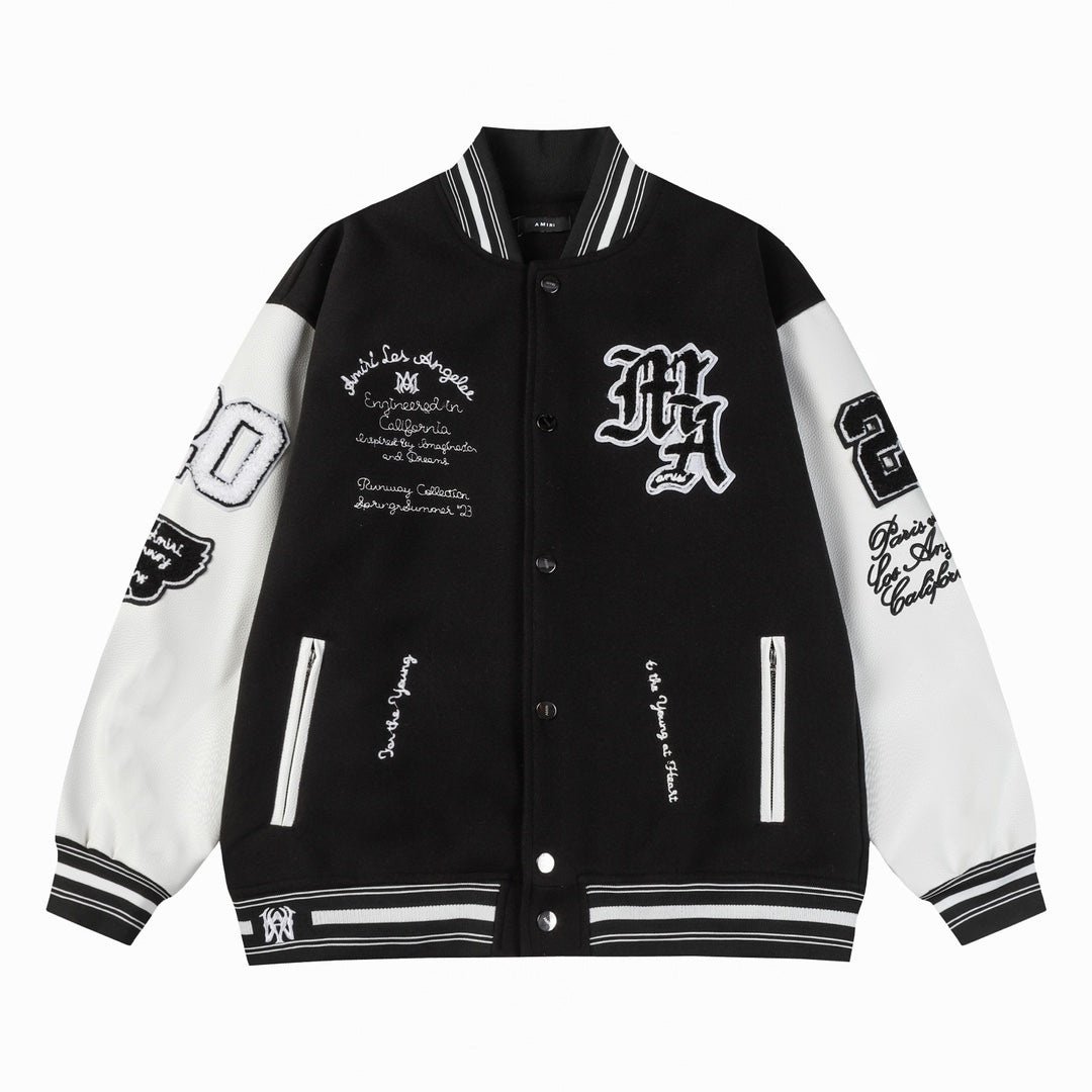 Black and white varsity jacket with snap buttons, ribbed collar, and striped cuffs