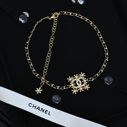 Gold-tone Chanel necklace with snowflake charms and linked chain