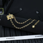 Gold-tone Chanel necklace with snowflake pendant and star charm details