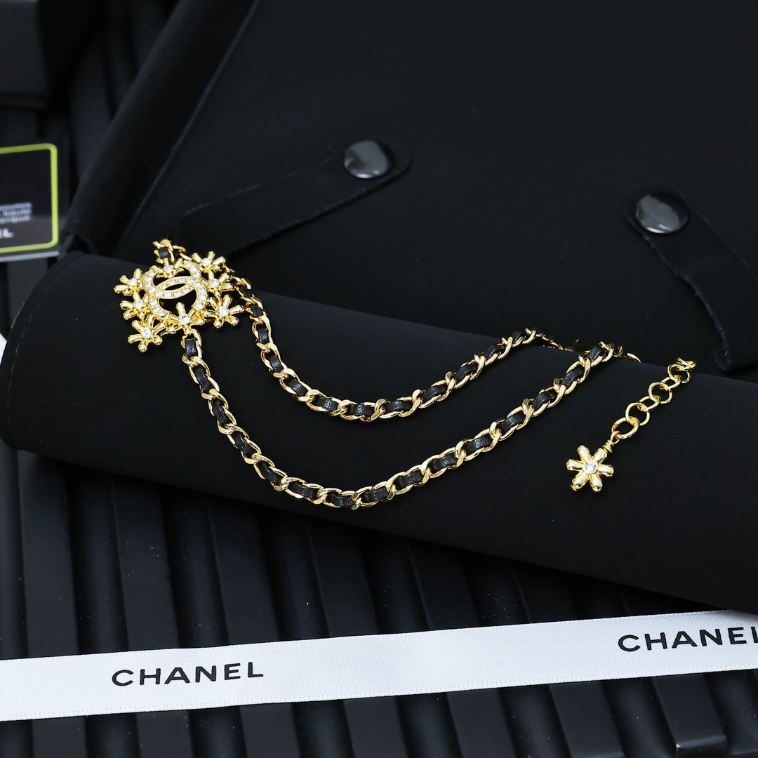 Gold-tone Chanel necklace with snowflake pendant and star charm details