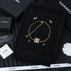 Gold-tone Chanel necklace with snowflake charms on linked chain