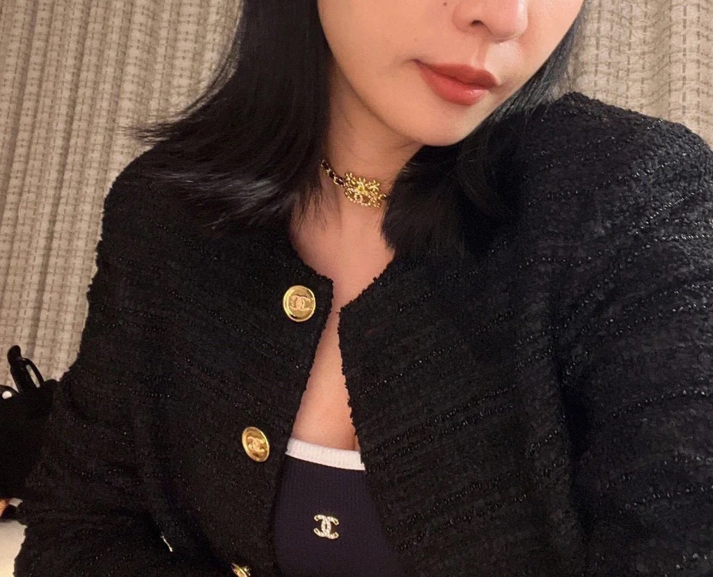 Gold-tone Chanel choker-style necklace with floral medallion at neckline