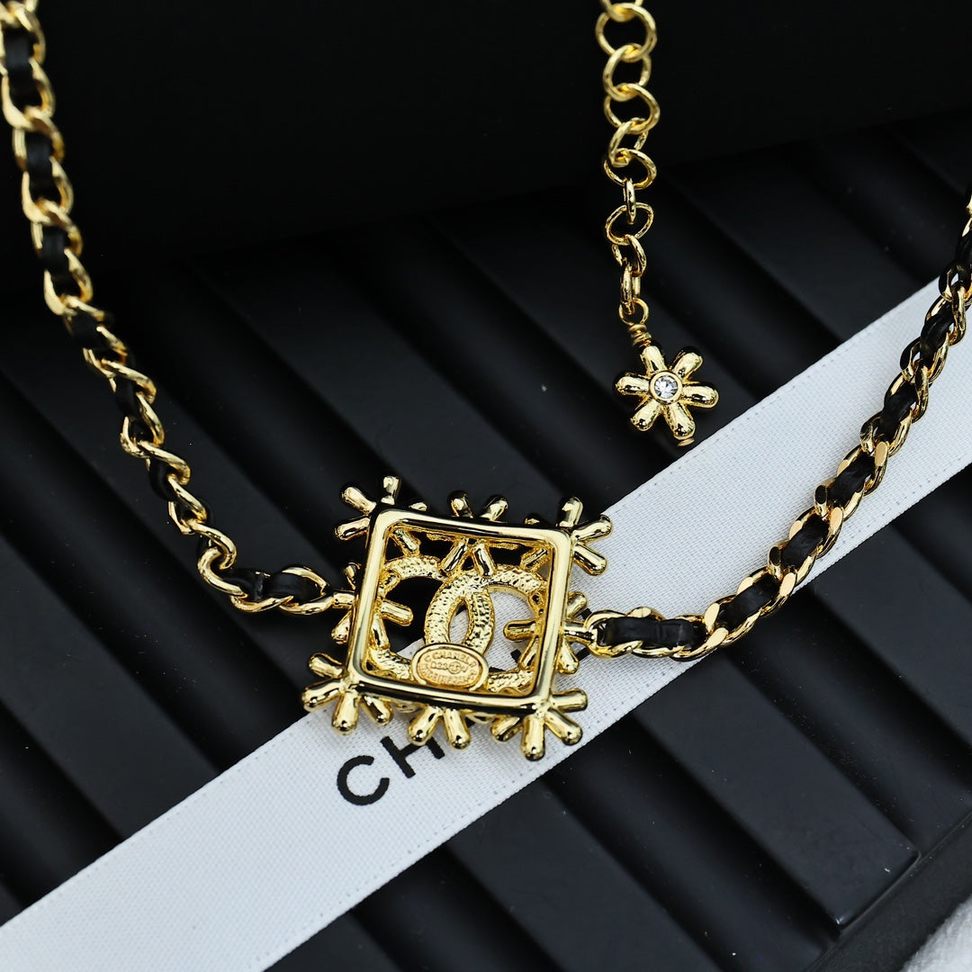 Gold-tone Chanel necklace with square CC medallion and star accents