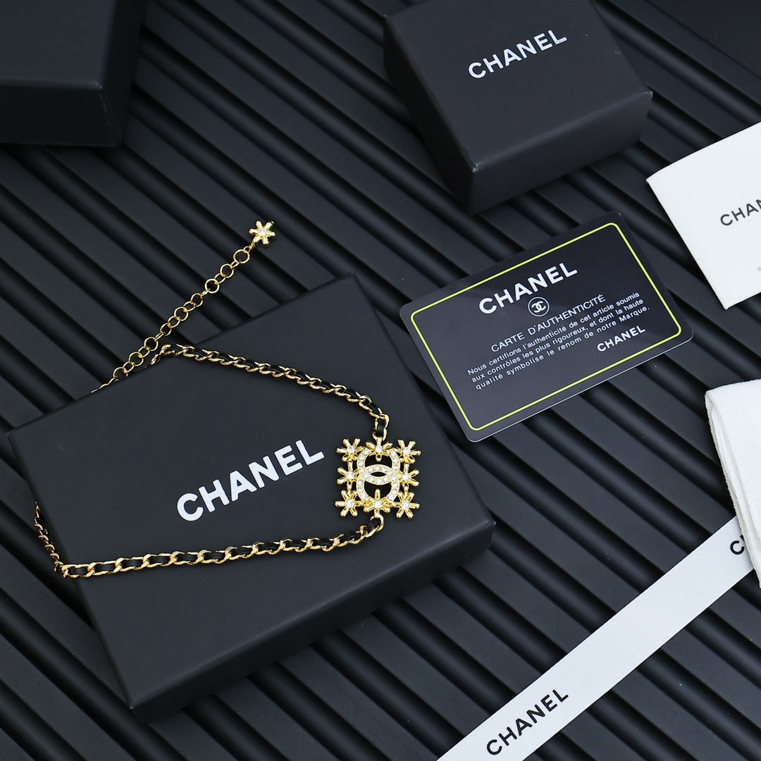 Gold-tone Chanel bracelet chain with snowflake CC medallion charm