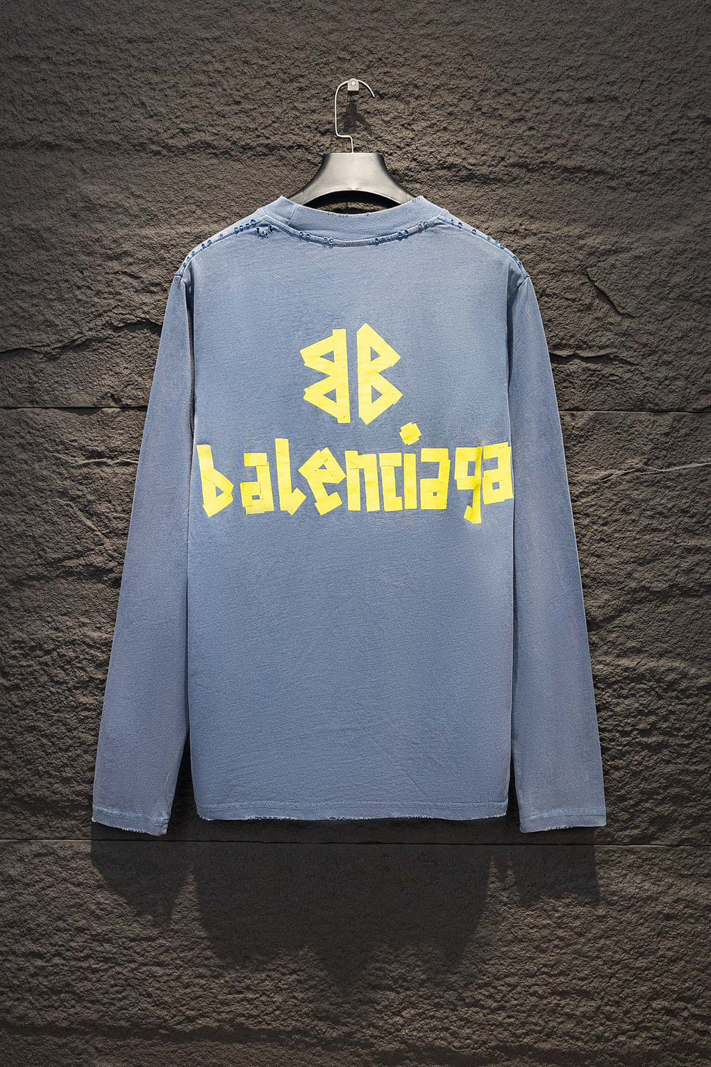 Light blue long-sleeve shirt with yellow and blue Balenciaga logo on the back