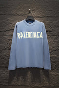 Light blue long-sleeve shirt with large Balenciaga logo print on the front