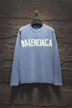 Light blue long-sleeve shirt with large Balenciaga logo print on the front