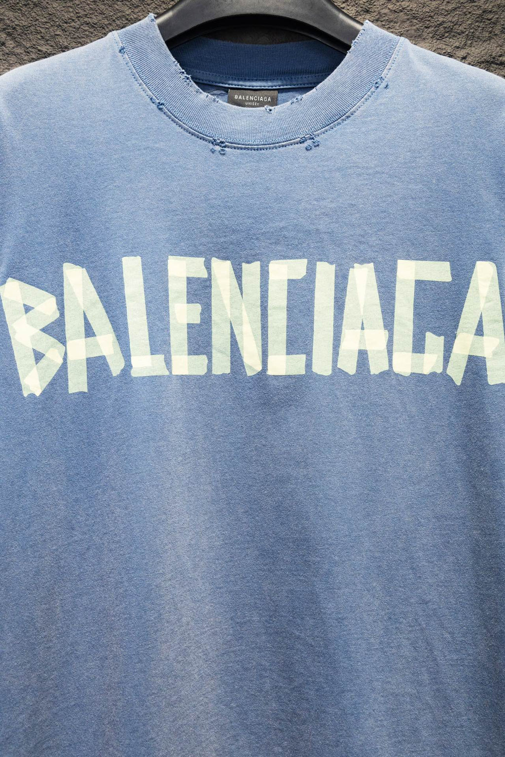 Light blue long-sleeve shirt with oversized front Balenciaga word graphic