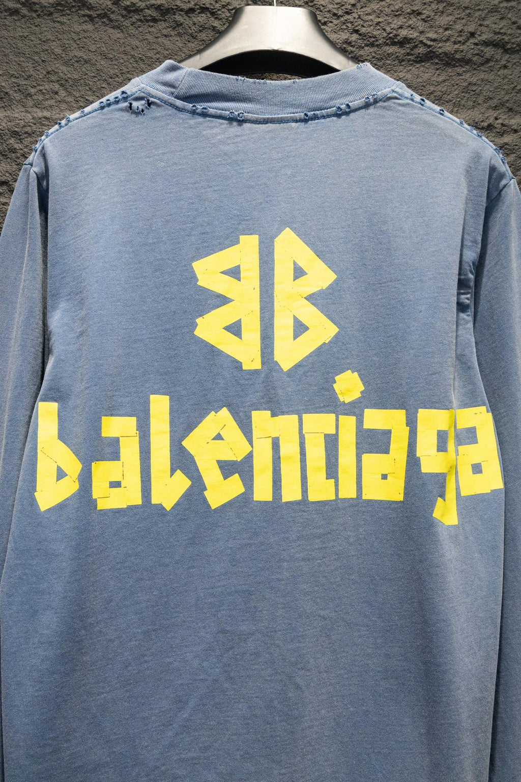 Light blue long-sleeve shirt back with yellow Balenciaga graphic and logo