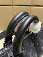 Louis Vuitton monogram satchel bag, dark gray, curved leather top handle detail