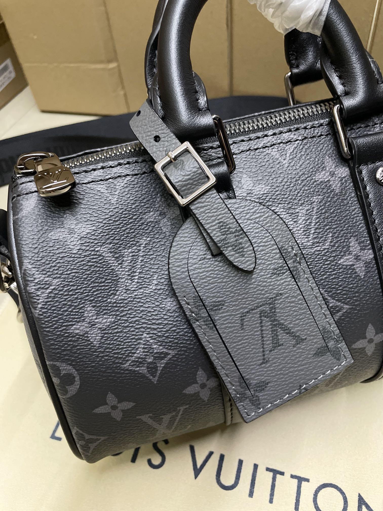 Louis Vuitton monogram satchel bag, dark gray, front buckle and tassel charm