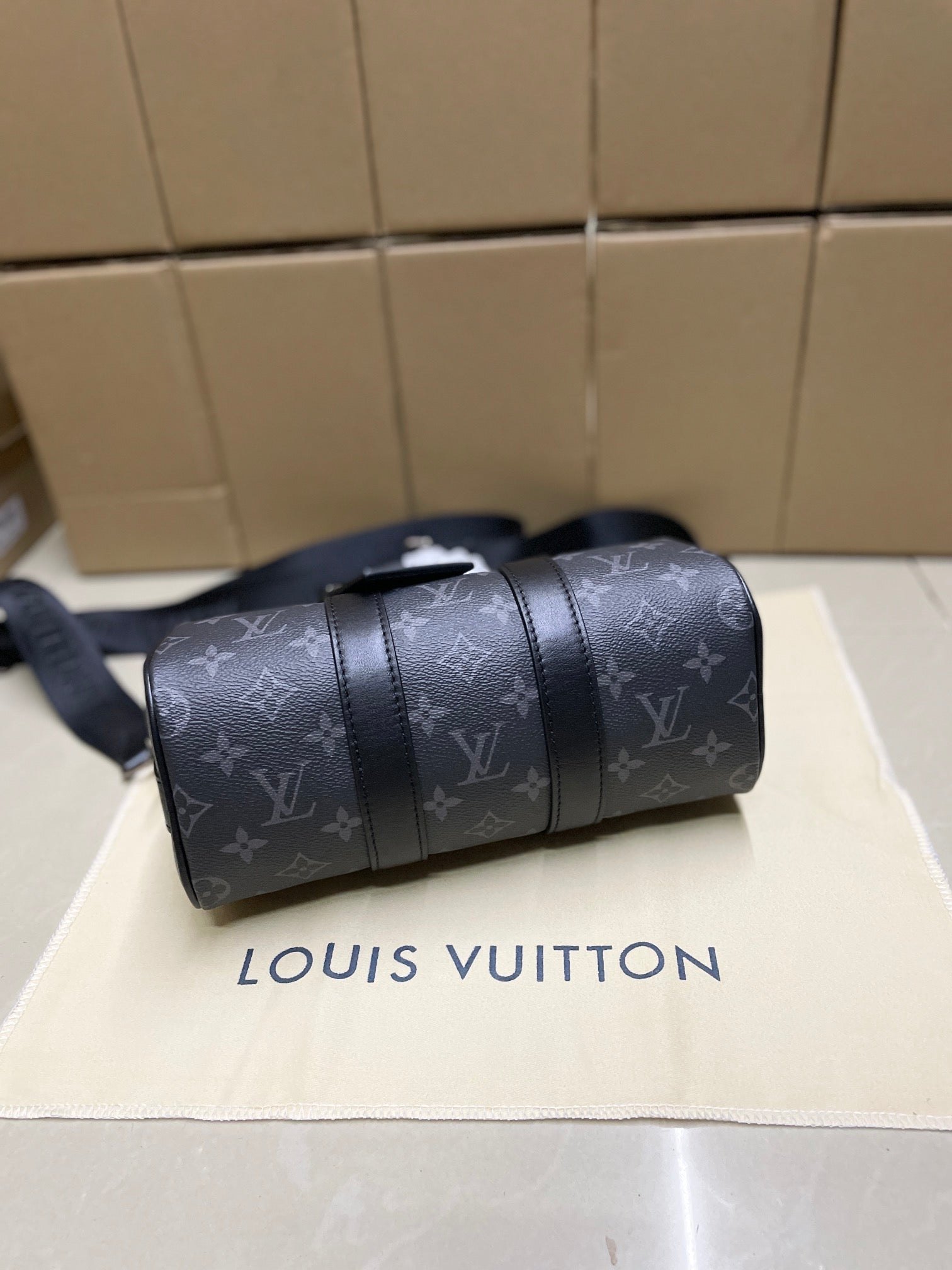 Louis Vuitton monogram satchel bag, dark gray, angled side with shoulder strap