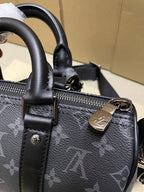 Louis Vuitton monogram satchel bag, dark gray, zipper pull and strap hardware detail
