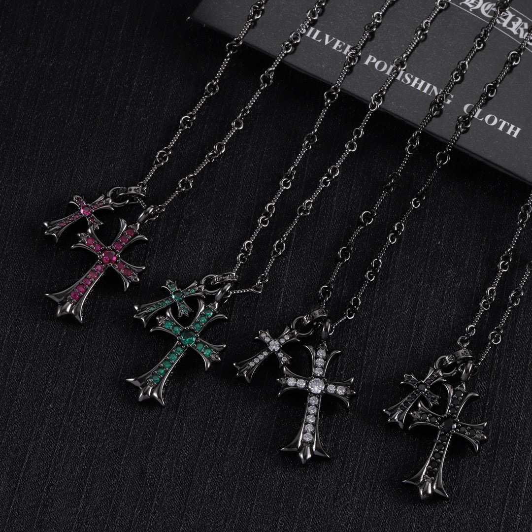 Cross pendant necklace set with silver-tone chains and pink/green accent stone crosses