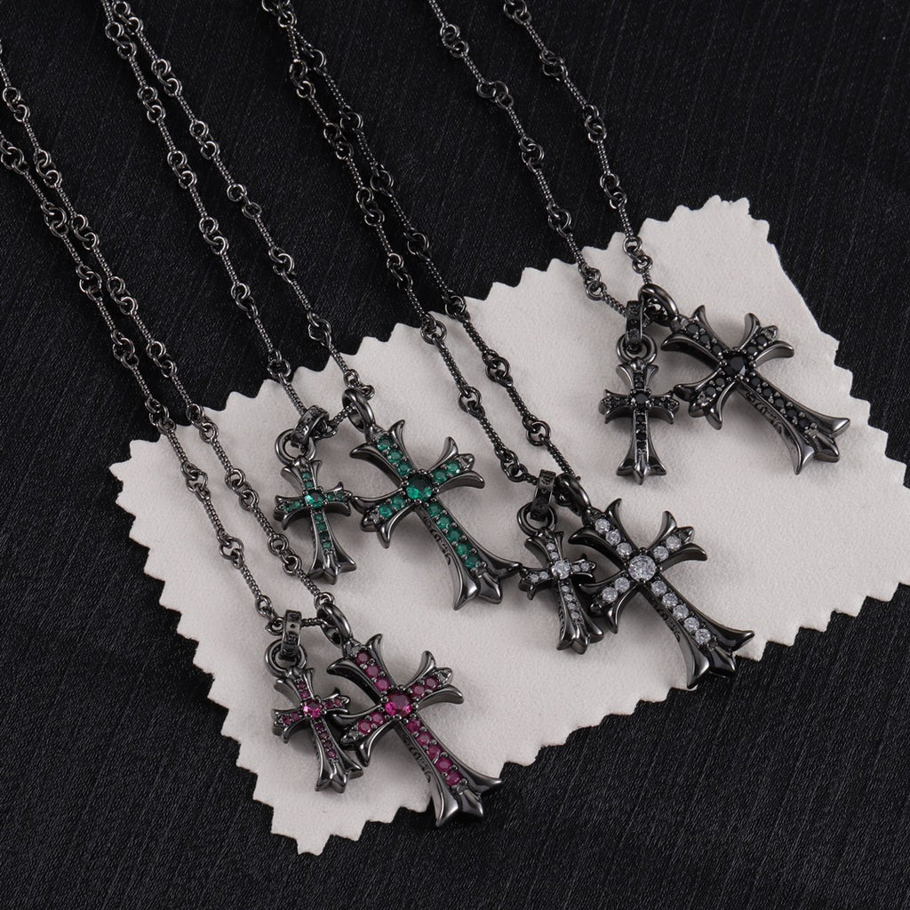 Cross pendant necklace set with silver-tone chains and pink, green, and clear stone crosses