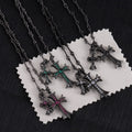 Cross pendant necklace set with silver-tone chains and pink, green, and clear stone crosses