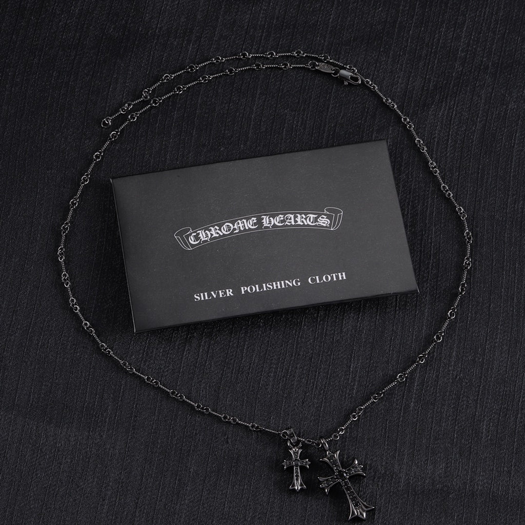 Chrome Hearts silver polishing cloth with two silver-tone cross pendant necklaces