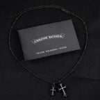 Chrome Hearts silver polishing cloth with silver-tone cross pendant necklace and pink stones