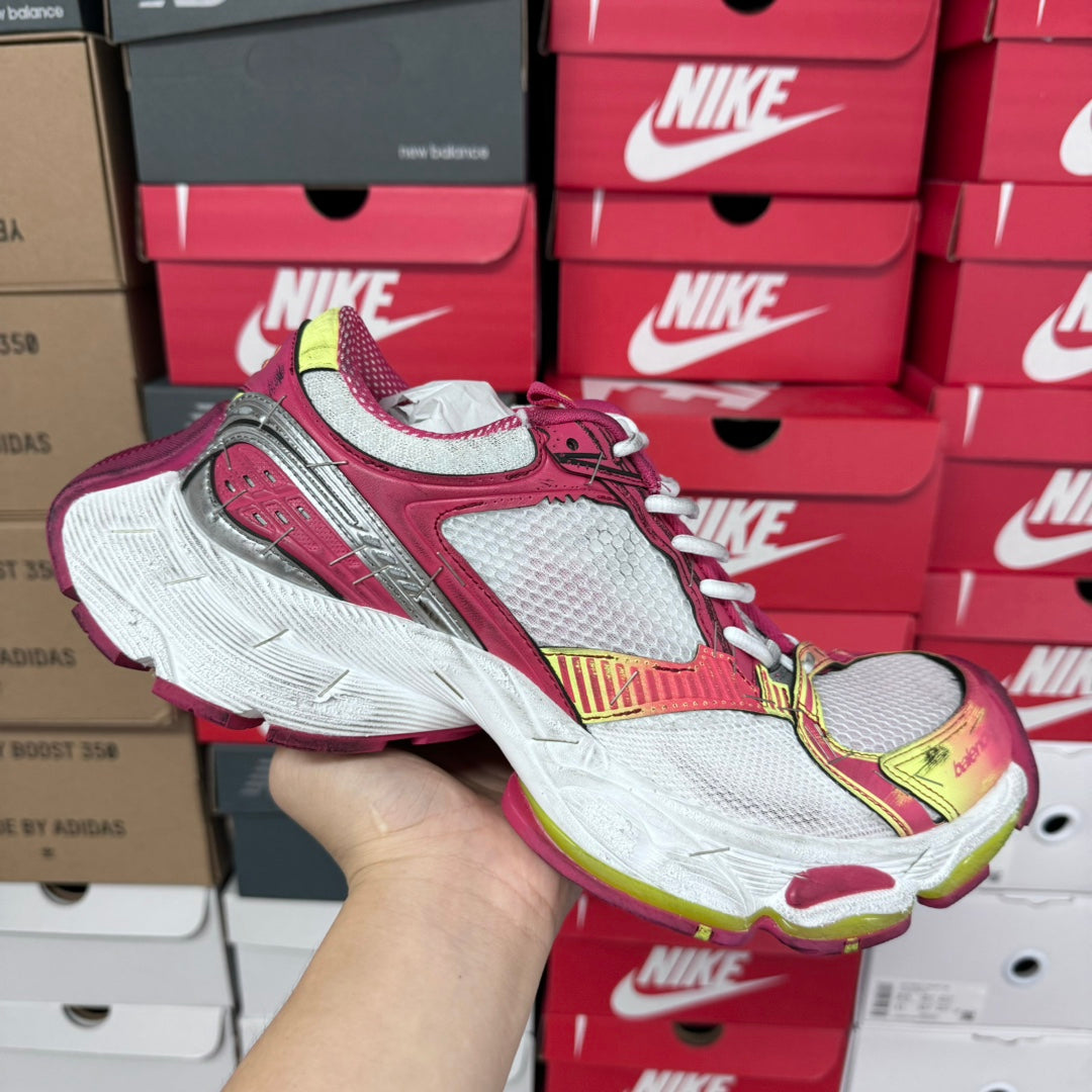 Pink, white, and gray lace-up sneakers with multicolor trim and thick white sole