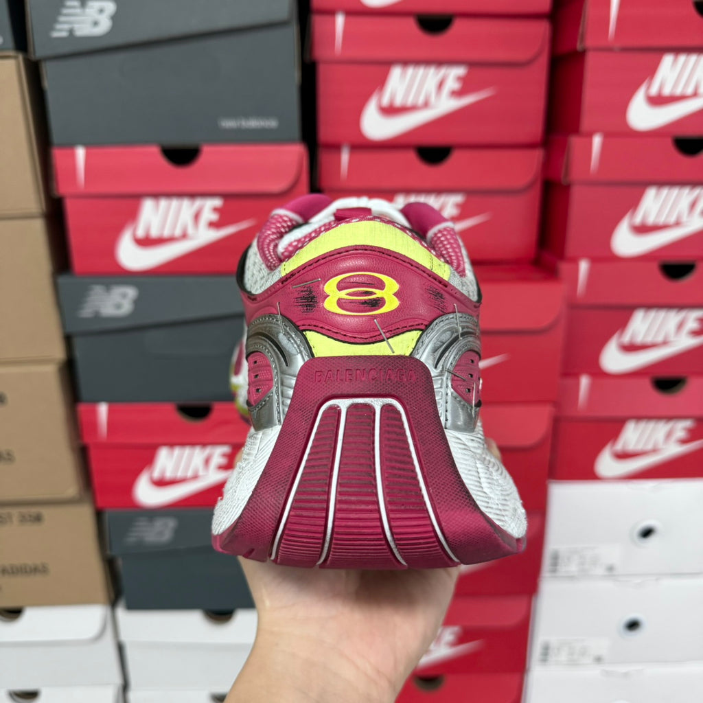 Back view of pink and gray sneakers with multicolor heel patch and white sole