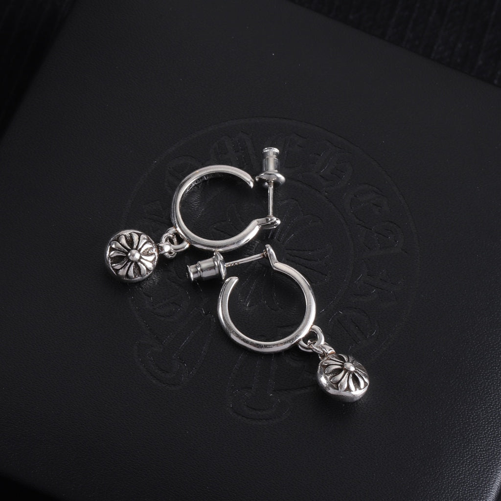 Silver hoop earrings with two dangling flower charms and bar closure hardware
