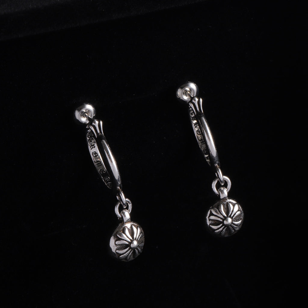 Silver drop hoop earrings with flower charm on a short linked chain