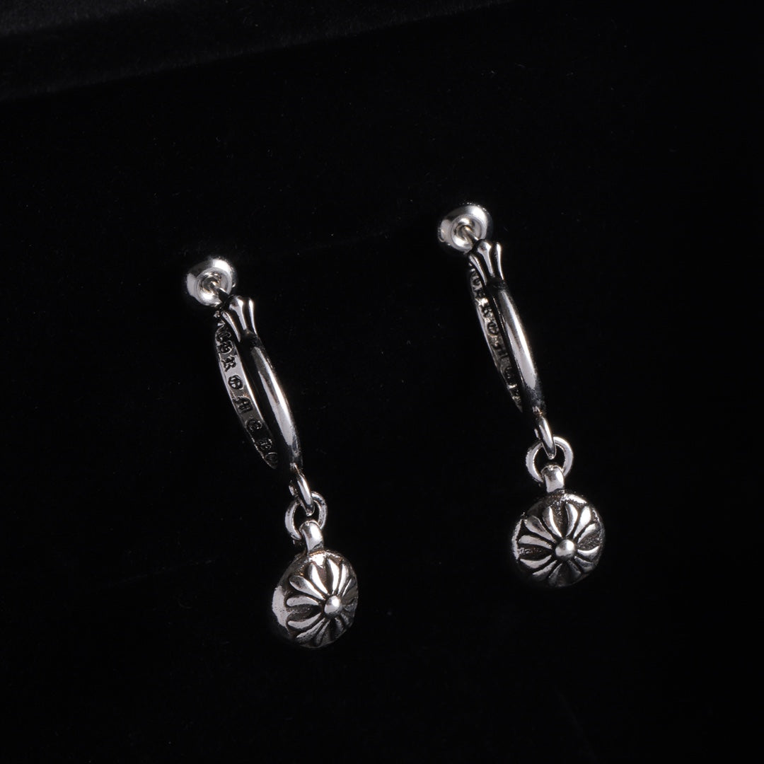 Silver drop hoop earrings with flower charm on a short linked chain