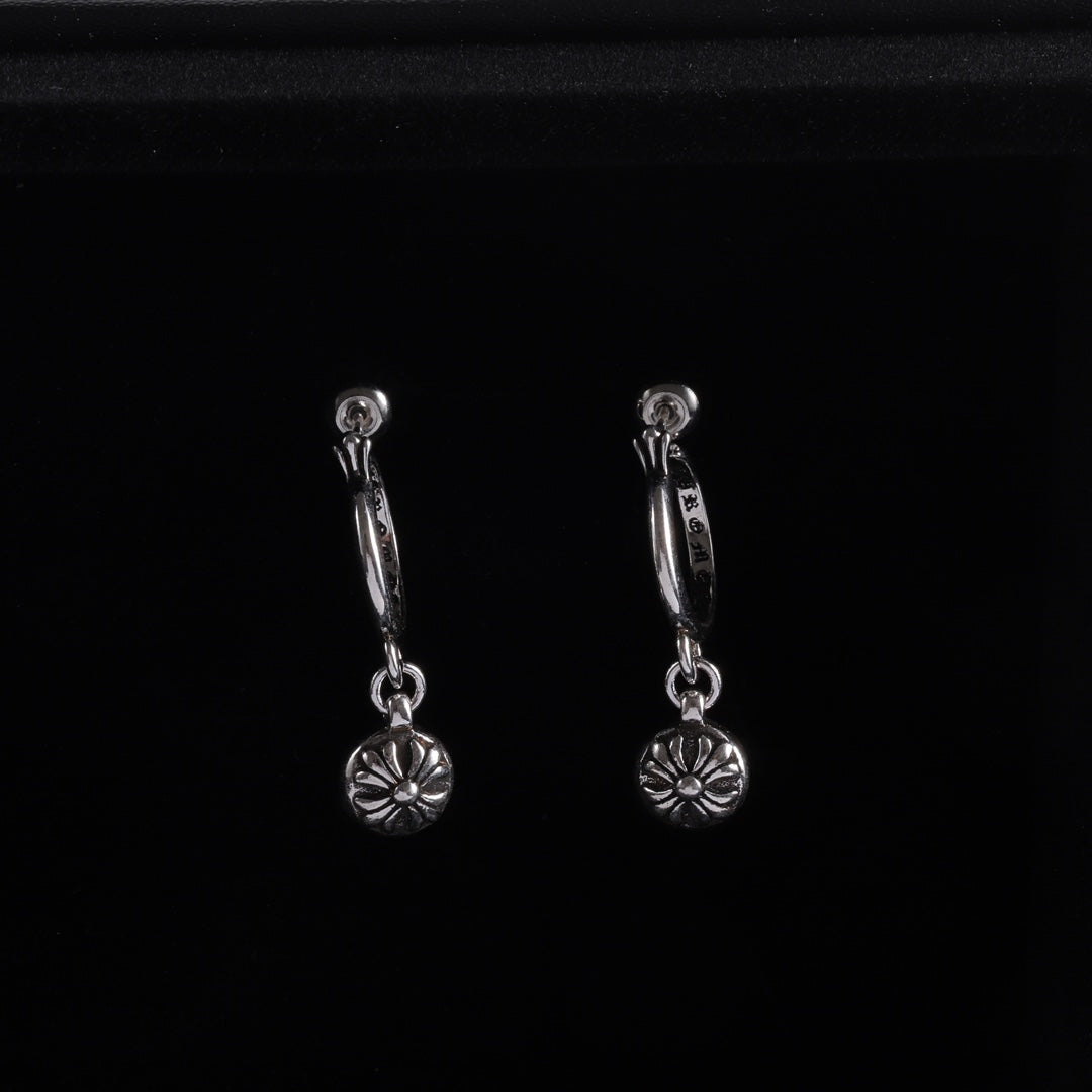 Silver hoop drop earrings with flower charms and linked chain details