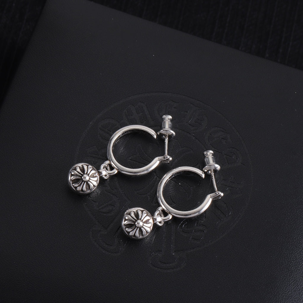 Silver hoop earrings with two dangling flower charms and bar-style clasp posts