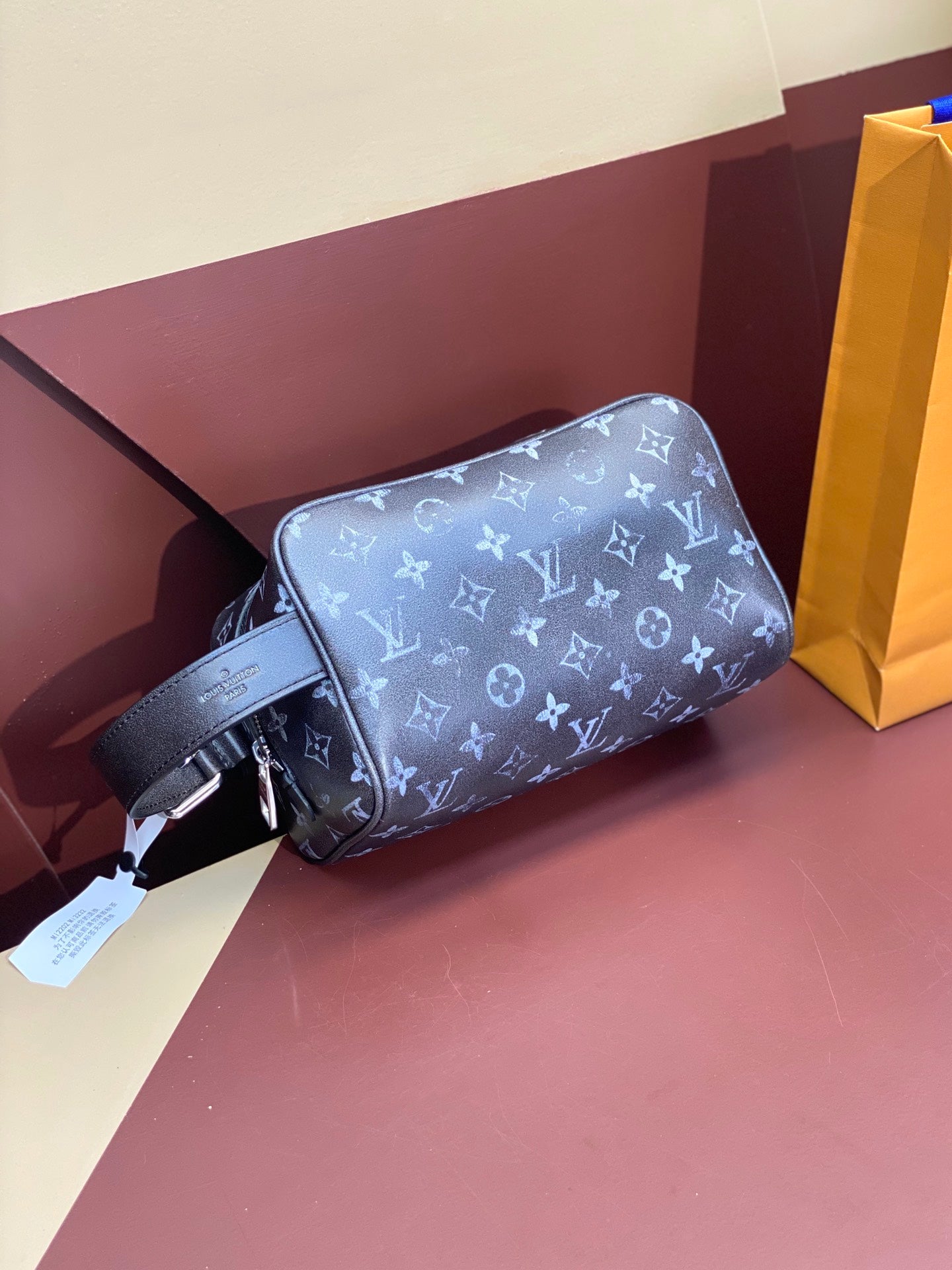 Louis Vuitton monogram crossbody pouch with strap and attached paper tag