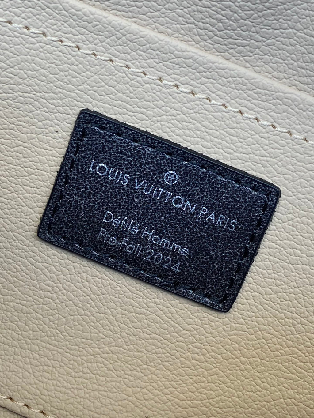 Louis Vuitton monogram bag interior leather label with printed text