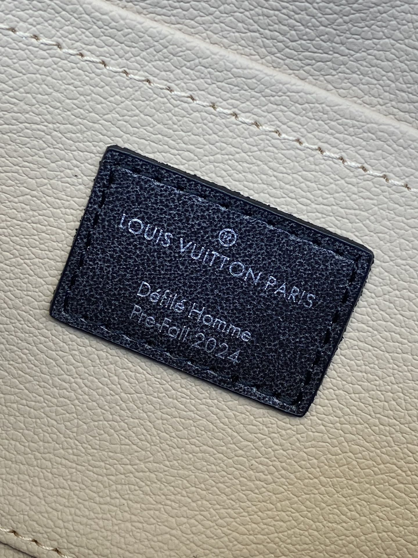 Louis Vuitton monogram bag interior leather label with printed text