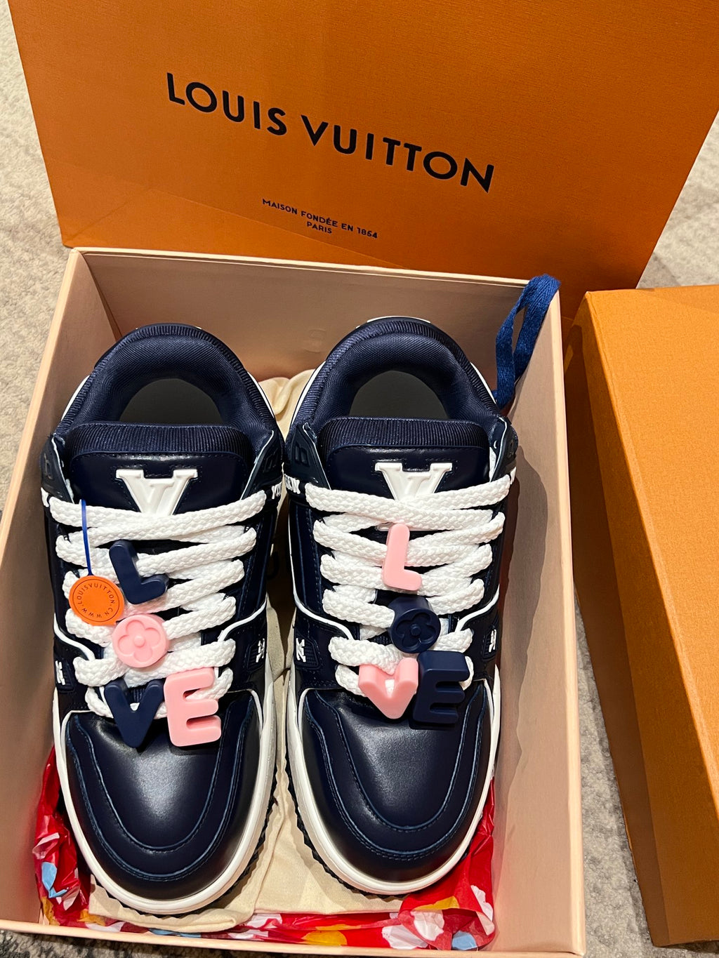 Louis Vuitton navy trainer sneakers with white laces and heart charm accents